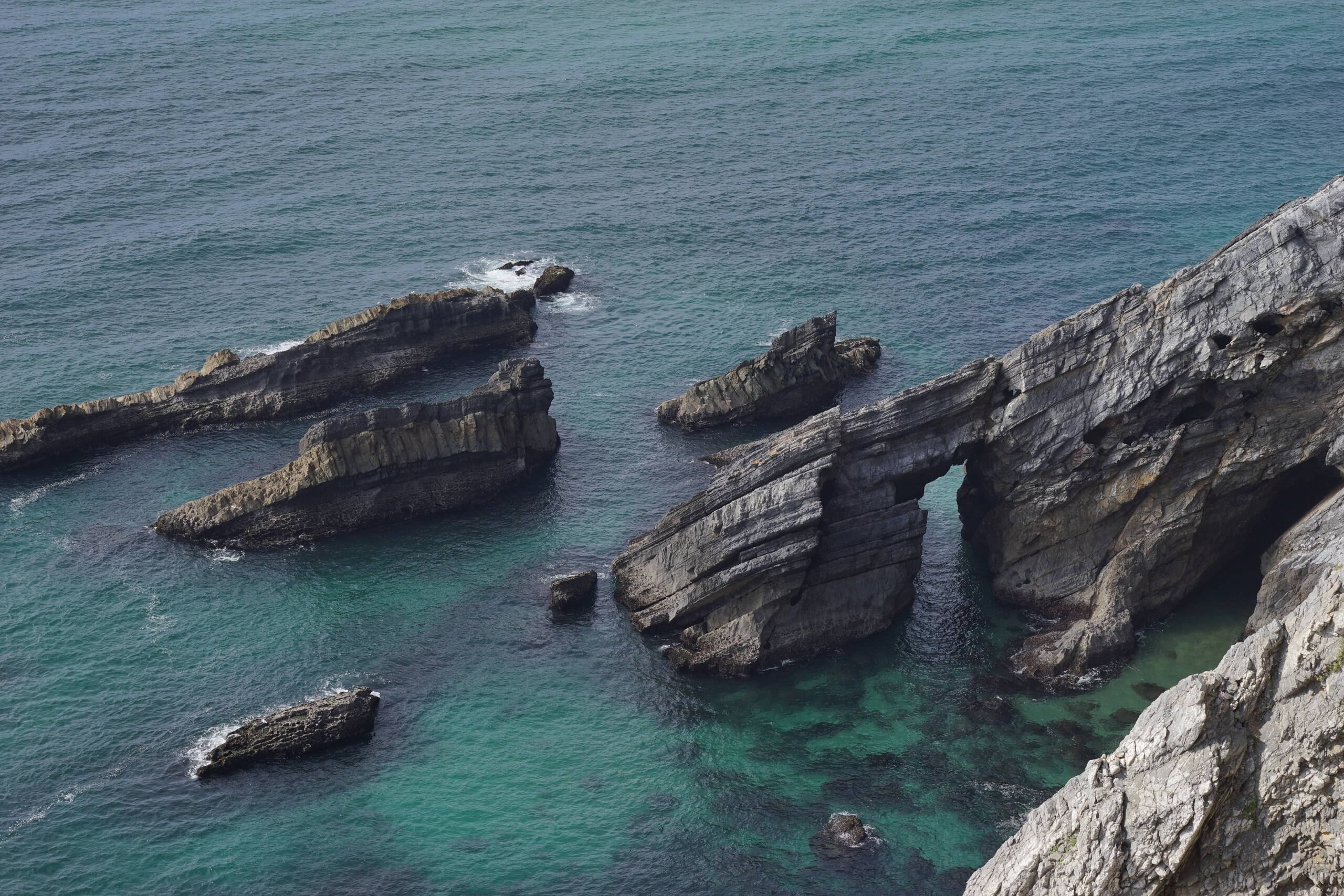 An image of cliffs in water.